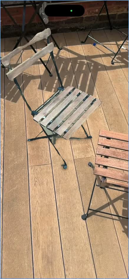 The actual RUUM prototype displaying a scanned outdoor chair in augmented reality